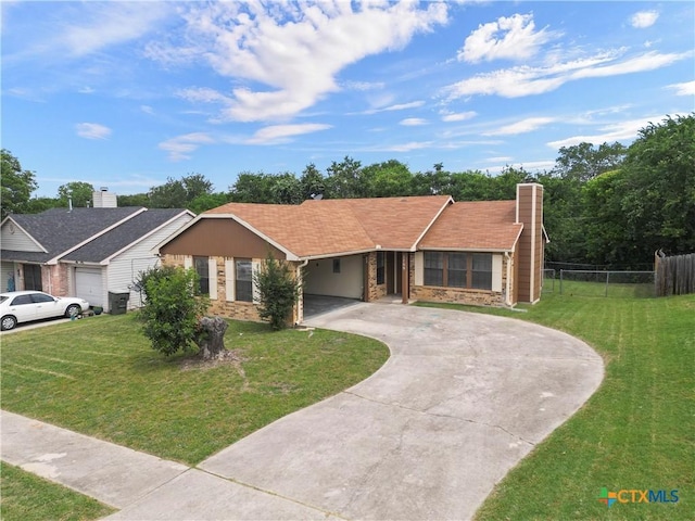 1709 Bobby Lee Dr, Killeen, TX 76549 - ranch-style house featuring curved driveway, a chimney, an attached carport, and stone siding