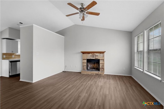 1709 Bobby Lee Dr, Killeen, TX 76549 - unfurnished living room with ceiling fan, dark wood-type flooring, a fireplace, lofted ceiling, and baseboards