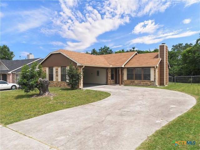 1709 Bobby Lee Dr, Killeen, TX 76549 - ranch-style house with curved driveway, a chimney, and an attached carport