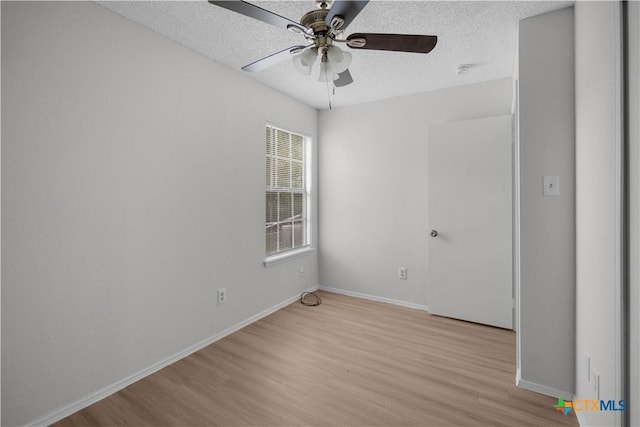 1709 Bobby Lee Dr, Killeen, TX 76549 - spare room with light wood-style floors, a ceiling fan, a textured ceiling, baseboards, and a smoke detector