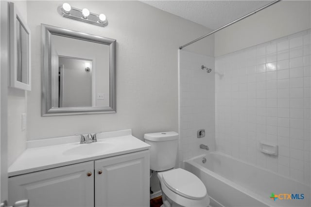 1709 Bobby Lee Dr, Killeen, TX 76549 - full bathroom with toilet, vanity,  shower combination, and a textured ceiling