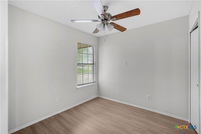 1709 Bobby Lee Dr, Killeen, TX 76549 - spare room with wood finished floors, a ceiling fan, and baseboards