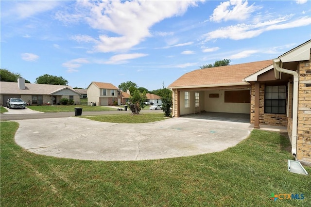 1709 Bobby Lee Dr, Killeen, TX 76549 - view of green lawn with a residential view and concrete driveway