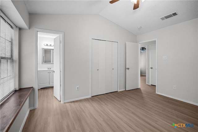 1709 Bobby Lee Dr, Killeen, TX 76549 - unfurnished bedroom featuring light wood-type flooring, vaulted ceiling, baseboards, a closet, and connected bathroom