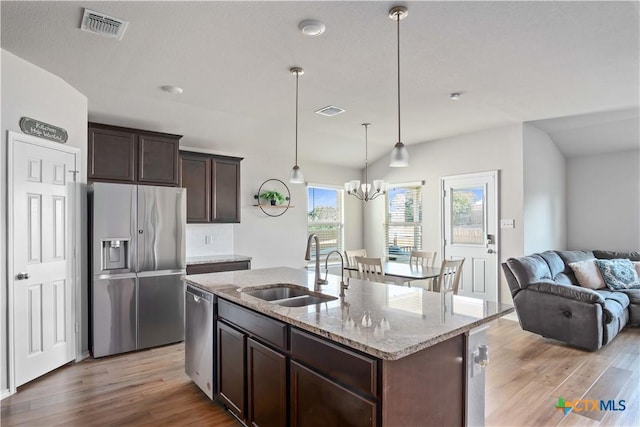 2215 Lucrezia Ct, Harker Heights, TX 76548 - kitchen featuring open floor plan, appliances with stainless steel finishes, a sink, and visible vents