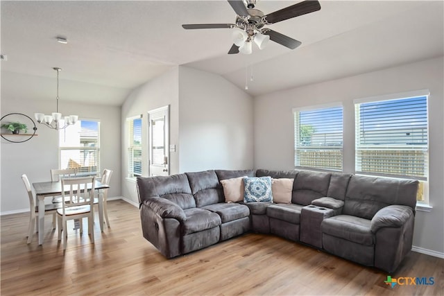 2215 Lucrezia Ct, Harker Heights, TX 76548 - living room with lofted ceiling, light wood-style floors, baseboards, and ceiling fan with notable chandelier