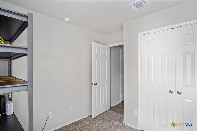 2215 Lucrezia Ct, Harker Heights, TX 76548 - unfurnished bedroom featuring carpet, a closet, visible vents, and baseboards