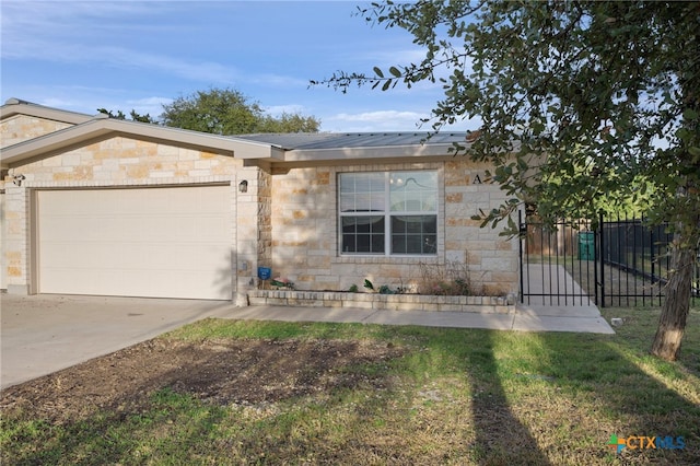 single story home featuring a garage, stone siding, driveway, and metal roof