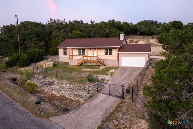 view of front of property featuring a garage and covered porch