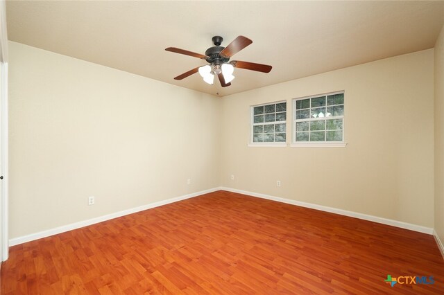 unfurnished room featuring wood-type flooring and ceiling fan