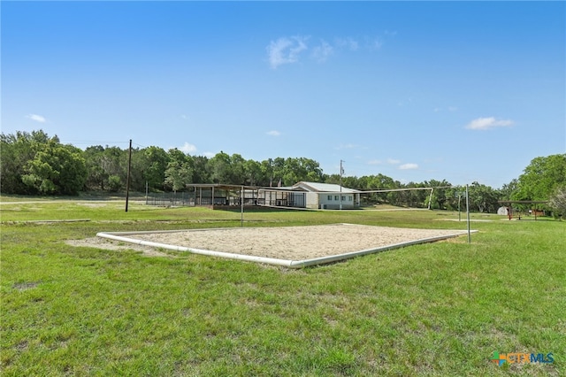 view of property's community featuring a yard, a rural view, and volleyball court