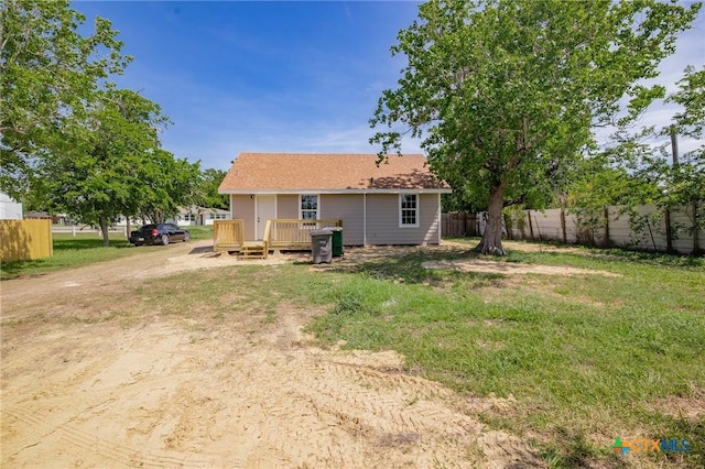 2603 Lone Tree Rd, Victoria, TX 77901 - rear view of property featuring a wooden deck and dirt driveway