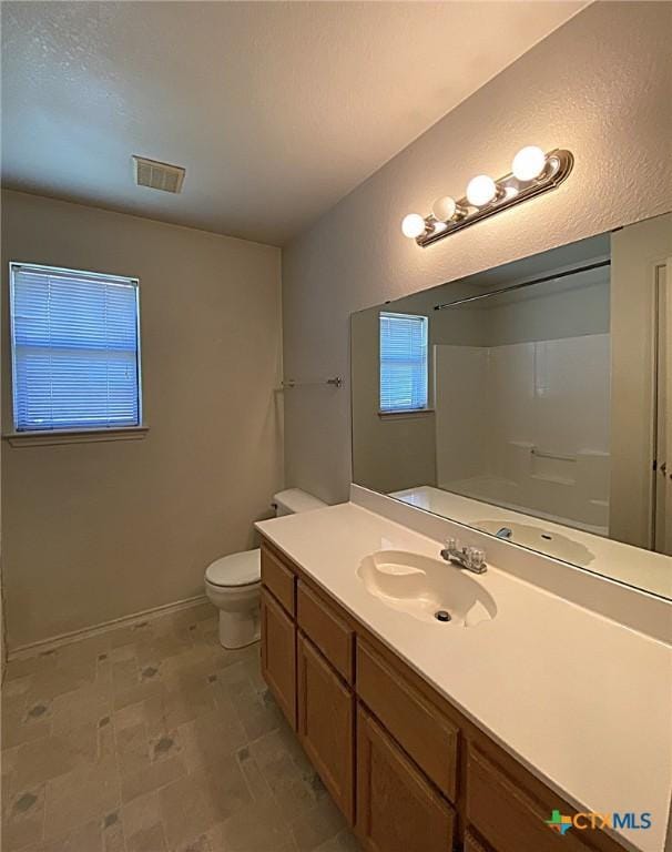 317 Janelle Dr, Copperas Cove, TX 76522 - bathroom with vanity, toilet, and a shower