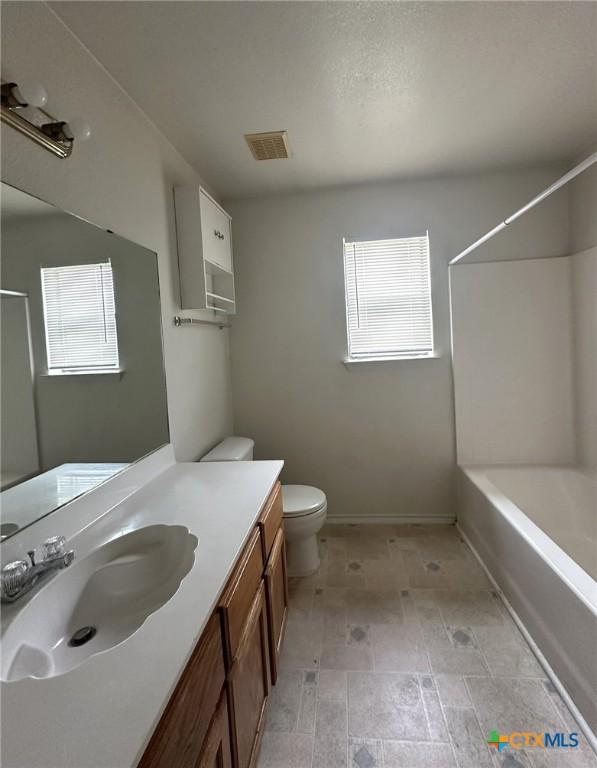 317 Janelle Dr, Copperas Cove, TX 76522 - full bathroom with vanity, bathing tub / shower combination, and toilet