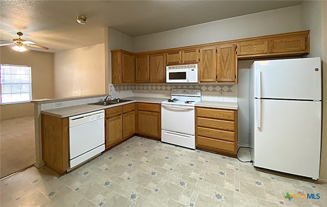 317 Janelle Dr, Copperas Cove, TX 76522 - kitchen featuring sink, white appliances, ceiling fan, tasteful backsplash, and kitchen peninsula