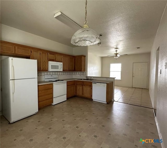 317 Janelle Dr, Copperas Cove, TX 76522 - kitchen with sink, white appliances, ceiling fan, tasteful backsplash, and decorative light fixtures