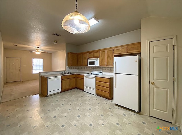 317 Janelle Dr, Copperas Cove, TX 76522 - kitchen featuring sink, white appliances, hanging light fixtures, ceiling fan, and backsplash