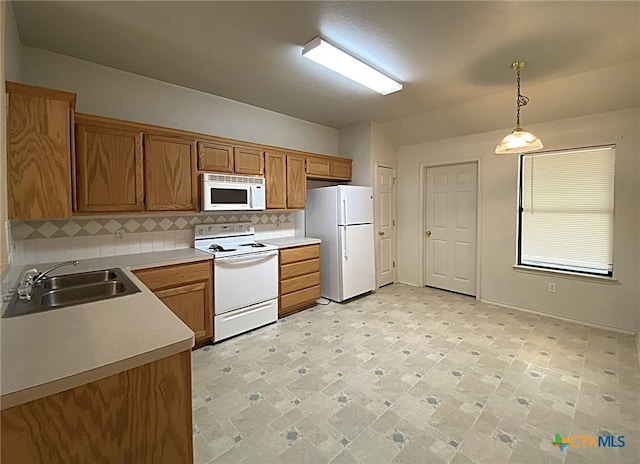 317 Janelle Dr, Copperas Cove, TX 76522 - kitchen with sink, pendant lighting, backsplash, and white appliances