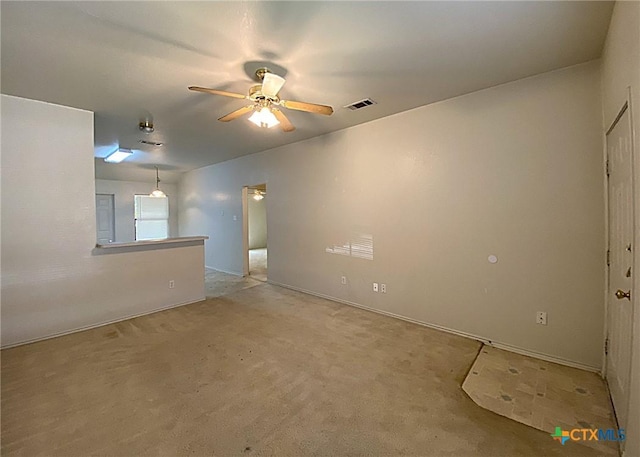 carpeted empty room with ceiling fan