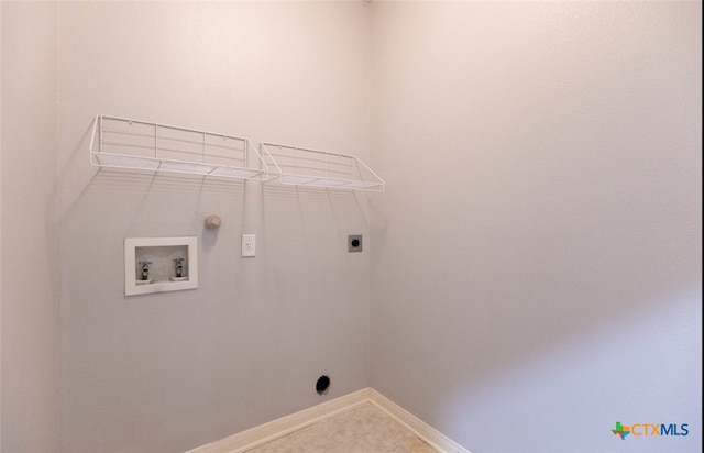 clothes washing area with hookup for a washing machine, laundry area, electric dryer hookup, and baseboards