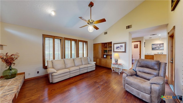 living room featuring ceiling fan, high vaulted ceiling, and dark hardwood / wood-style floors