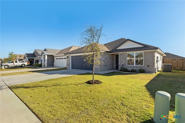 single story home with a garage, central AC unit, and a front yard