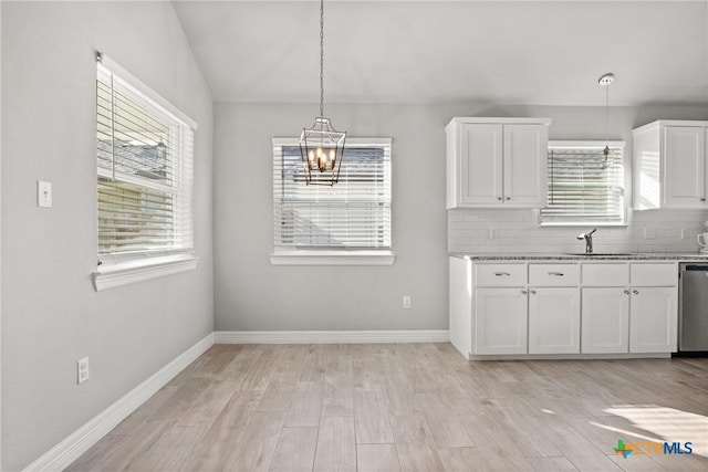 1519 Curlew Ln, Temple, TX 76502 - kitchen featuring a chandelier, plenty of natural light, white cabinetry, and light wood-type flooring