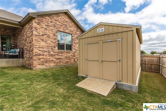 view of outdoor structure with a lawn