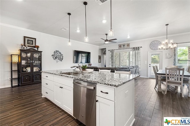 kitchen with stainless steel dishwasher, a sink, ornamental molding, wood finish floors, and a chandelier