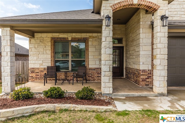 view of exterior entry with a garage