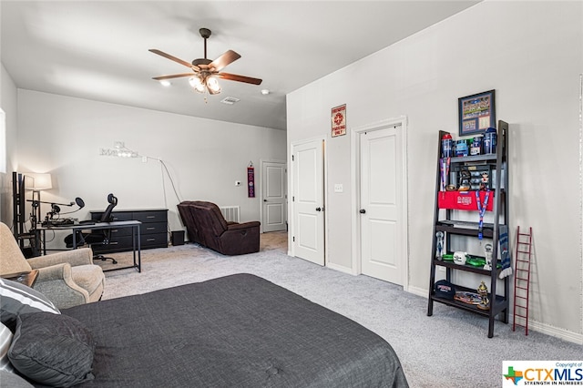 bedroom featuring light carpet and ceiling fan