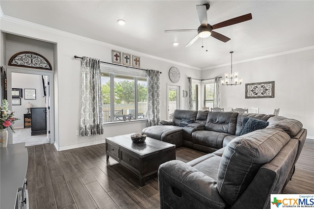 living room with dark hardwood / wood-style flooring, ceiling fan with notable chandelier, and crown molding