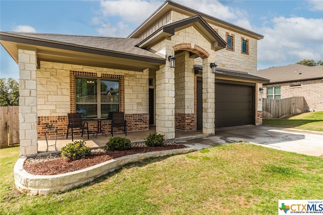 view of front facade with a garage and a front yard