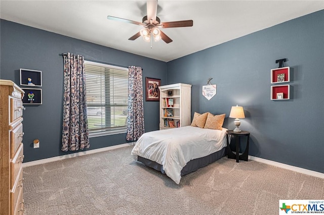 bedroom with carpet flooring, baseboards, and a ceiling fan