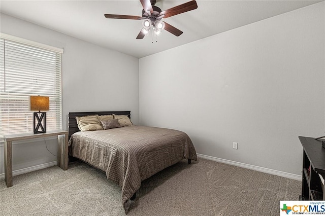 bedroom with carpet floors, baseboards, and ceiling fan