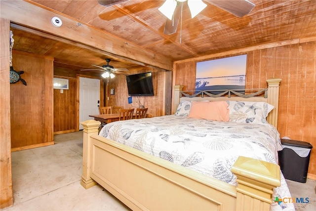 bedroom with beam ceiling, concrete floors, wooden ceiling, and wood walls