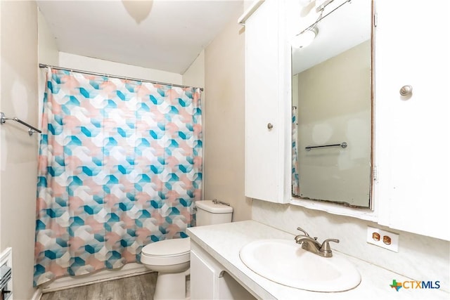 318 Durr St, Marlin, TX 76661 - bathroom with vanity, wood finished floors, and a shower with shower curtain