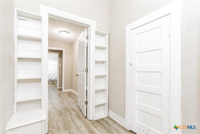 318 Durr St, Marlin, TX 76661 - hallway featuring light wood finished floors and baseboards