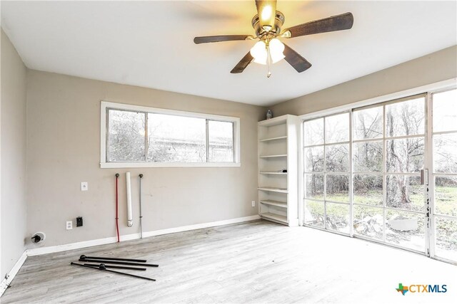 318 Durr St, Marlin, TX 76661 - laundry room featuring wood finished floors and ceiling fan