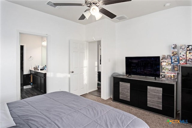 bedroom featuring ceiling fan, connected bathroom, and dark colored carpet