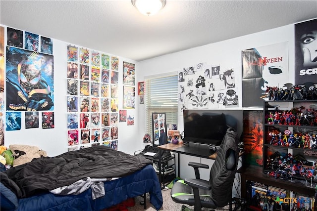 bedroom with carpet and a textured ceiling