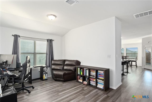 office area featuring wood-type flooring and lofted ceiling