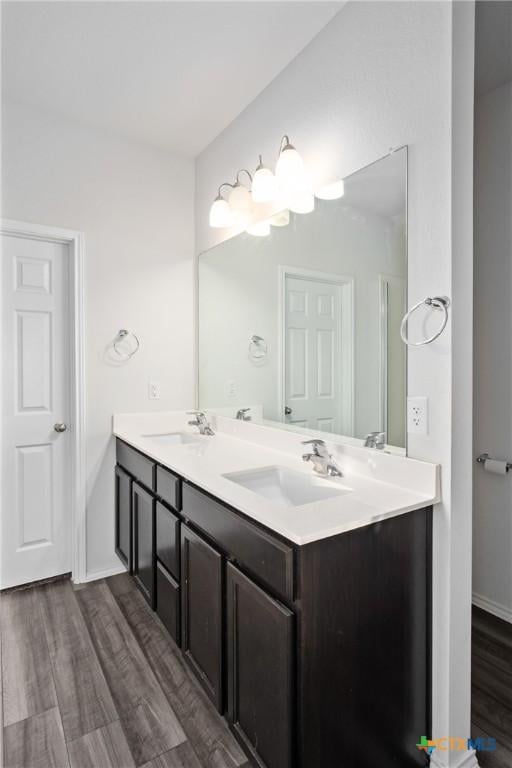 bathroom with vanity and hardwood / wood-style floors