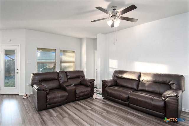 living room with ceiling fan and hardwood / wood-style floors