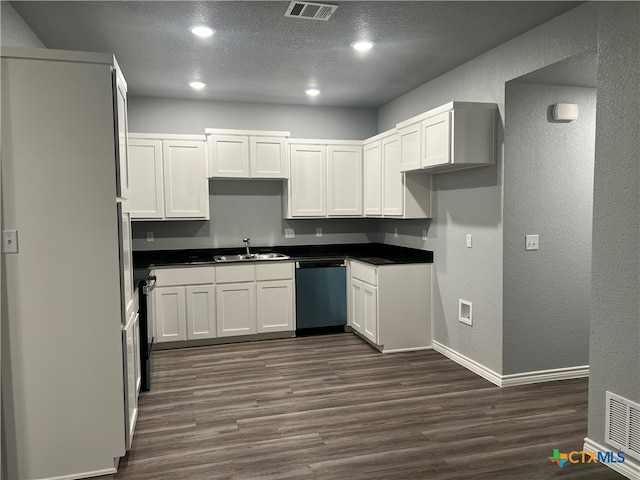 kitchen with white cabinetry, sink, stainless steel dishwasher, dark hardwood / wood-style floors, and a textured ceiling