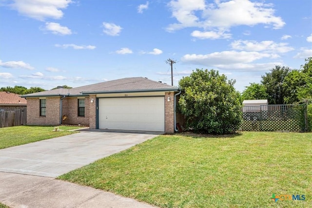 single story home featuring a front yard and a garage