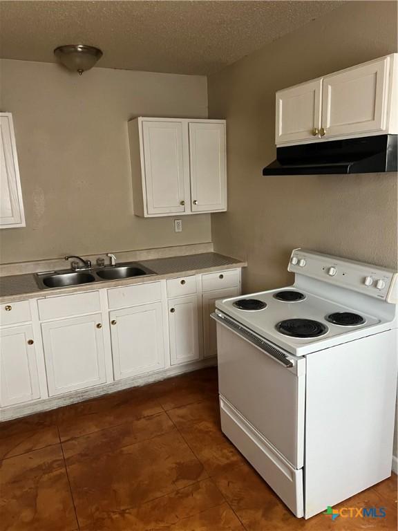 kitchen featuring white cabinets, white electric range oven, sink, and a textured ceiling