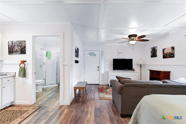 living area with dark wood finished floors and ceiling fan