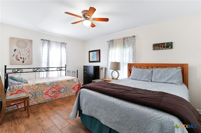 bedroom featuring ceiling fan and wood finished floors