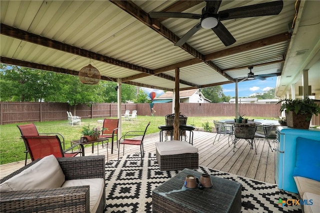 view of patio featuring outdoor dining area, an outdoor living space, a fenced backyard, and ceiling fan